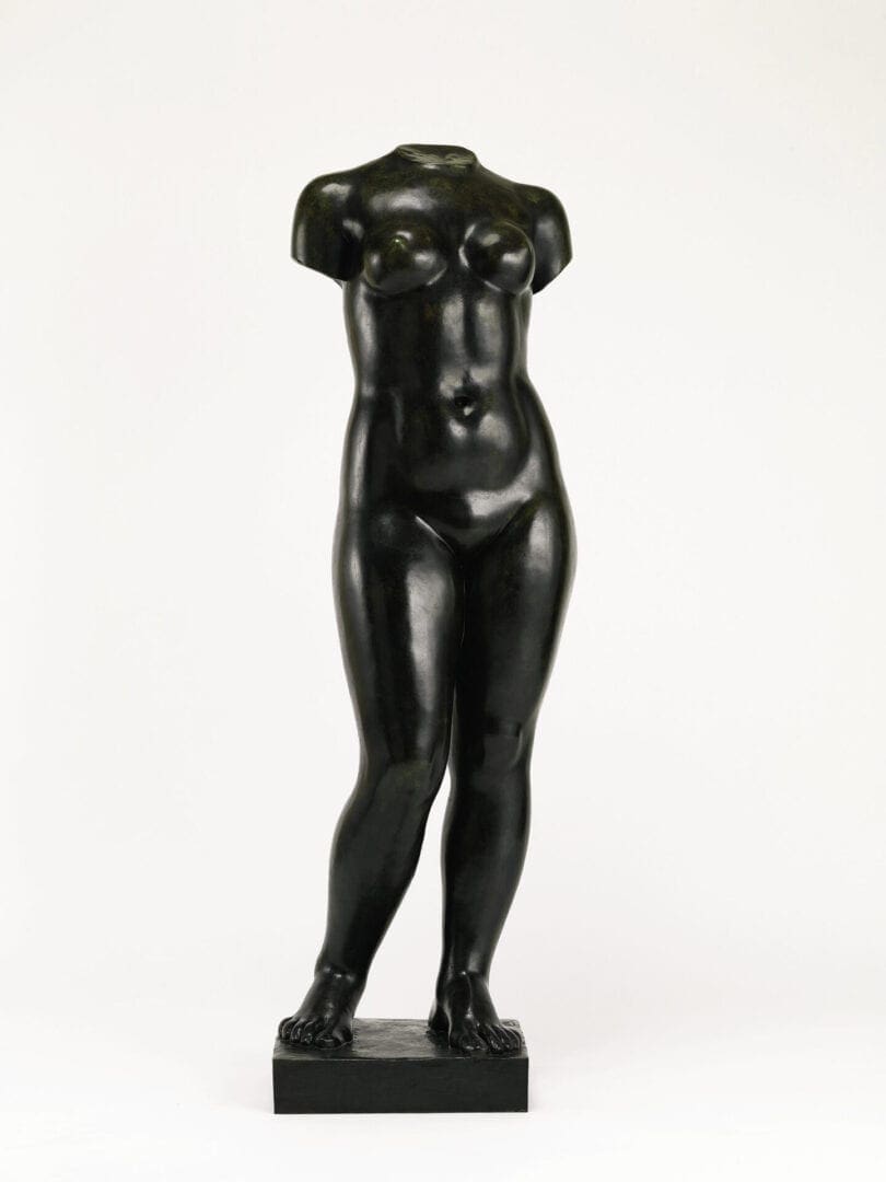 Bronze female torso sculpture standing on base