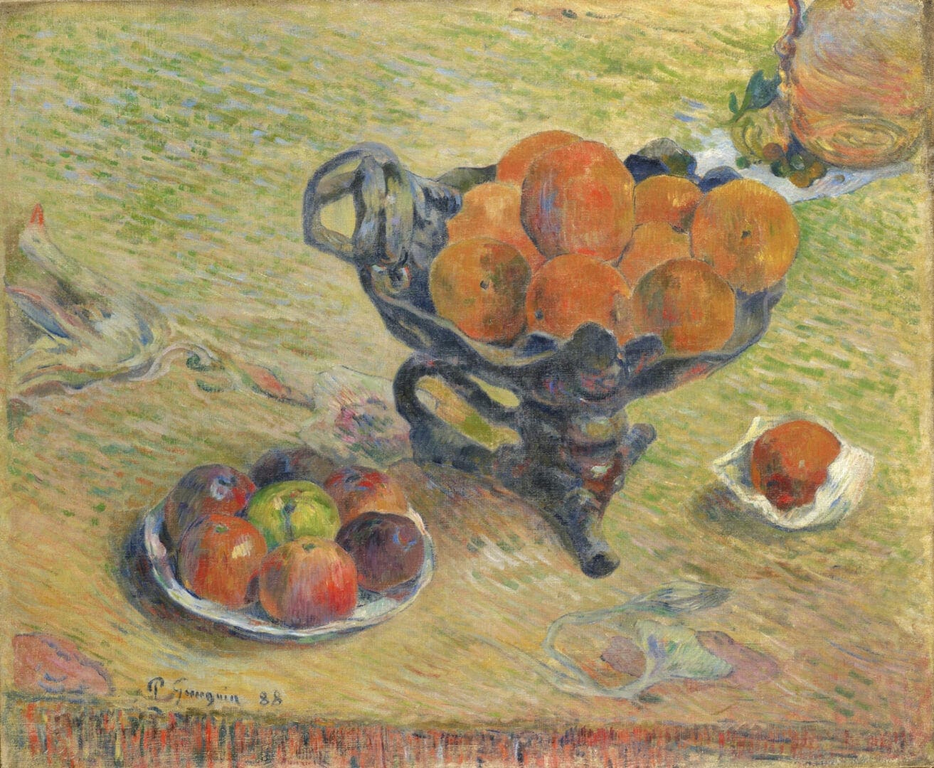 Ornate ceramic compote holding oranges on table